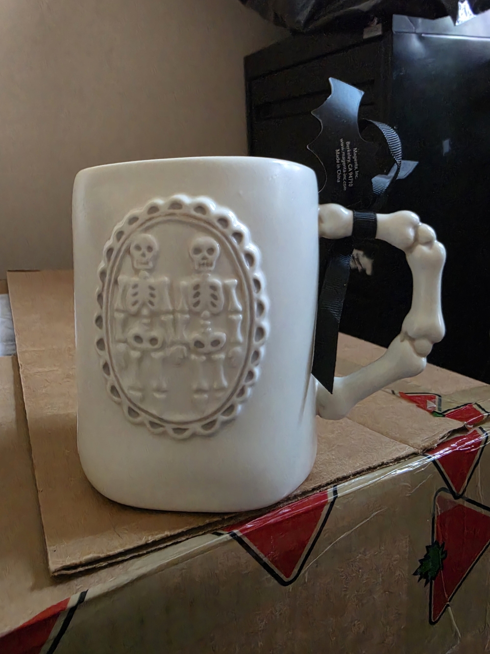 Rae Dunn Skeleton Mug with Bone Handle.